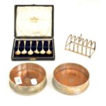 Pair of cased modern silver bottle coasters, silver toast rack, cased set of six silver teaspoons (
