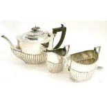 A silver three piece tea service, Birmingham 1915 and Sheffield 1910