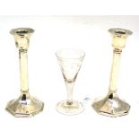 Georgian trumpet ale glass with engraved decoration and pair of loaded silver candlesticks (3)