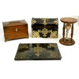 An ebony veneered stationary box and a blotting pad with applied metal mounts, egg timer, tea caddy