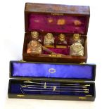 A 19th Century Mahogany Cased Travelling Pharmacy Set, containing five glass bottles with