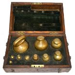 A Cased Part Set of Ten Spherical Brass 'Avoir' Weights, sizes from 7lb to 4dr, with various
