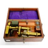 Hartnack & Prasmowski (Paris) Brass Microscope with draw tube focusing in mahogany case with