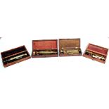 Four 19th Century Mahogany Cased Brass Enema Sets, one by S.Maw, London, the others unmarked, some