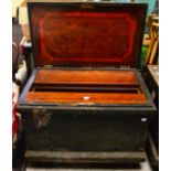A Large Pine Tool Box, with iron strapping and fitted mahogany interior, raised on castors