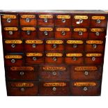 A 19th Century Mahogany Drug Run, with twenty eight graduated drawers, larger to the bottom, smaller