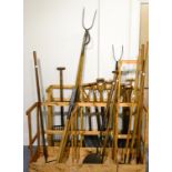 Twenty Early Wooden Handled Garden Tools, including spades, forks, rakes, hoes, billhook etc., in