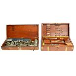 A Mahogany Cased Part Set of Surgical Instruments by Millikin & Lawley, the brass bound case with