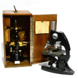 A Lacquered Brass and Black Enamelled Monocular Compound Microscope by C Reichert, serial number