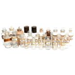 A Collection of Twenty Five Clear Glass Chemists Rounds, with verre eglomise and gilt labels,
