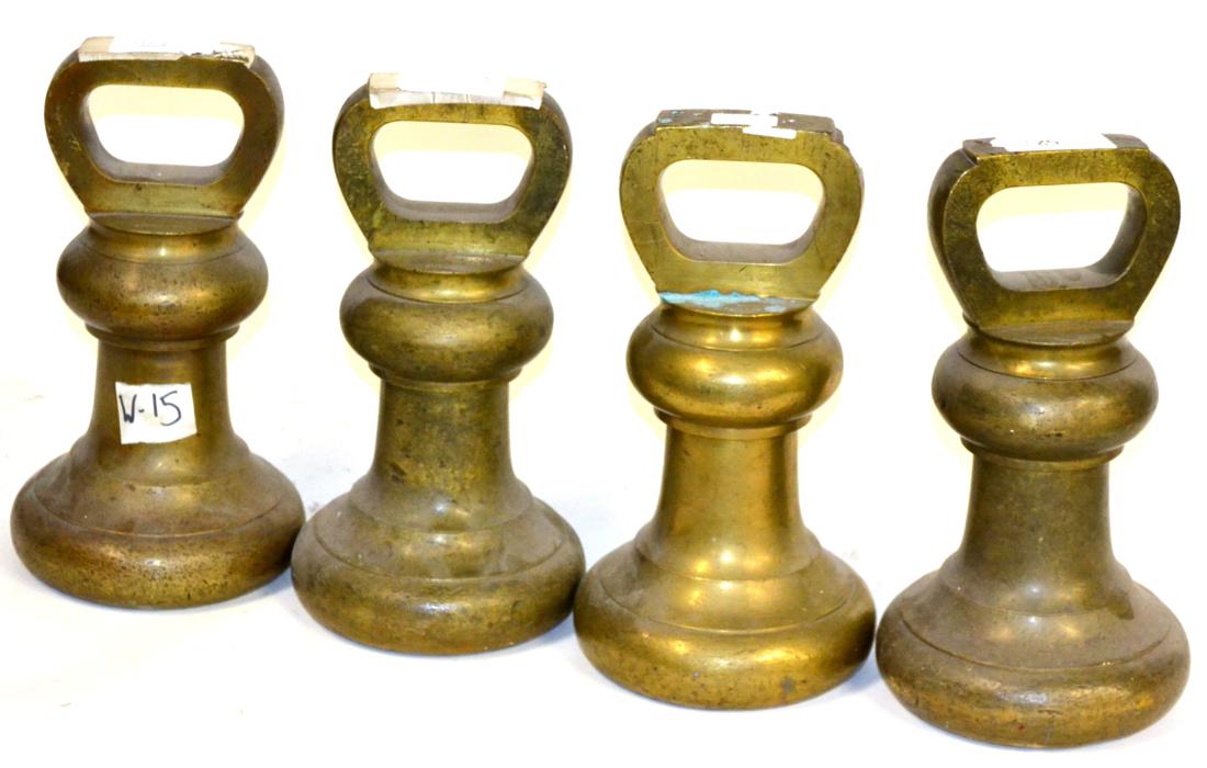 A Set of Four Avery 56lb Brass Bell Weights