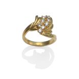 An 18 Carat Gold Diamond Set Ring, the spray form of eight round brilliant cut diamonds within fan