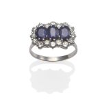 A Sapphire and Diamond Triple Cluster Ring, three oval cut sapphires within a border of round