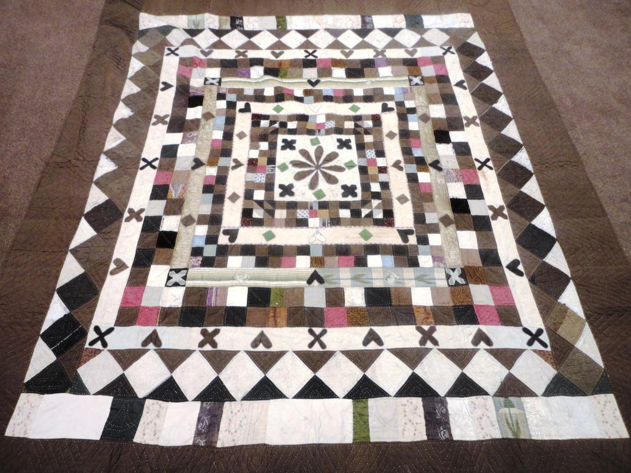 A 19th Century Patchwork 'Wedding' Quilt worked in coloured silks and brocades within a brown and - Image 2 of 7