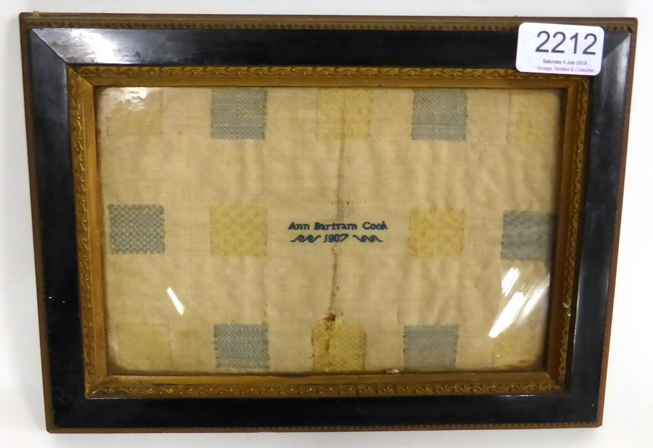 Early 19th Century Stitch Sampler worked by Ann Bartram Cook 1807, in yellow and blue threads,