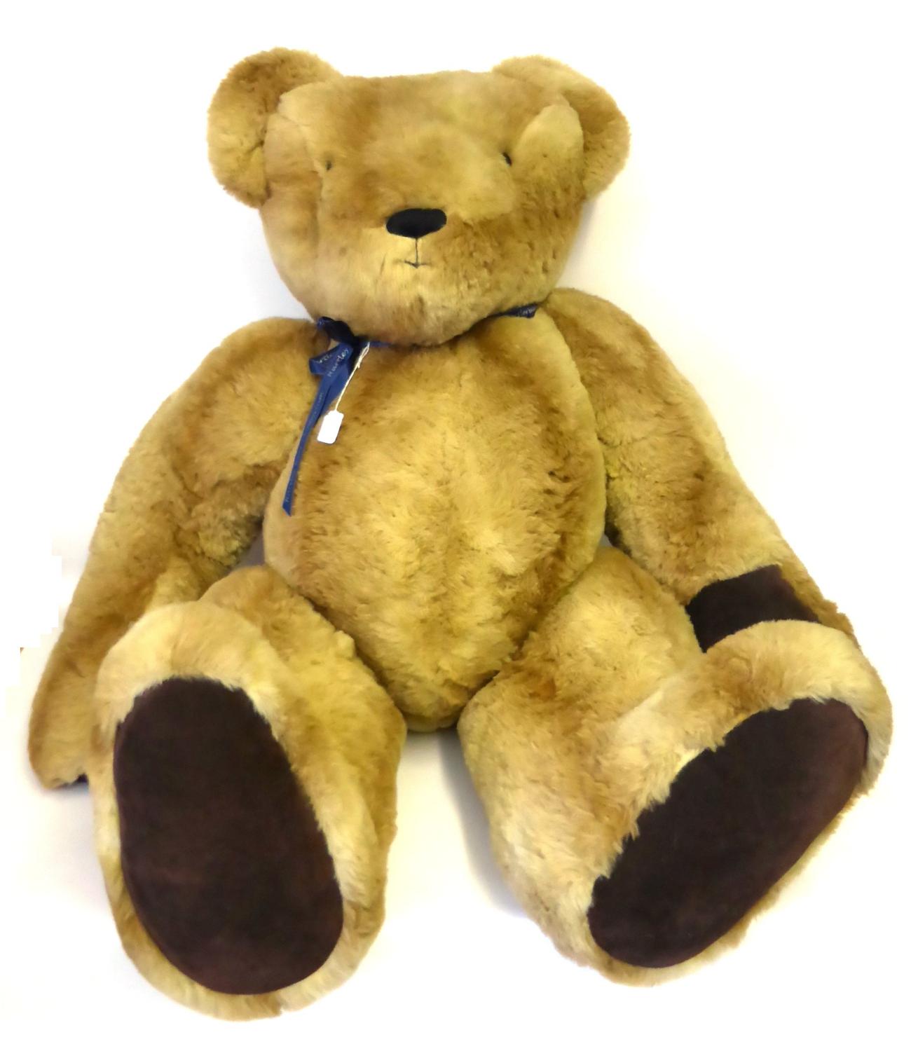 A Very Large Jointed Hartley Bear's Emporium Teddy Bear in light tan plush, dark tan suede paw pads,