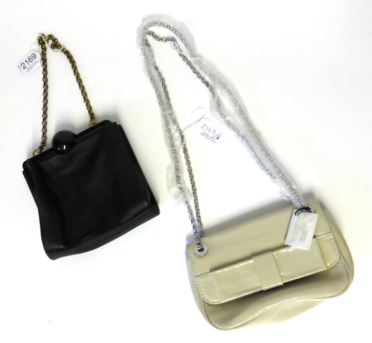 Lulu Guinness Cream Patent Anna Bow Bag with chain link shoulder strap, red lips on black printed