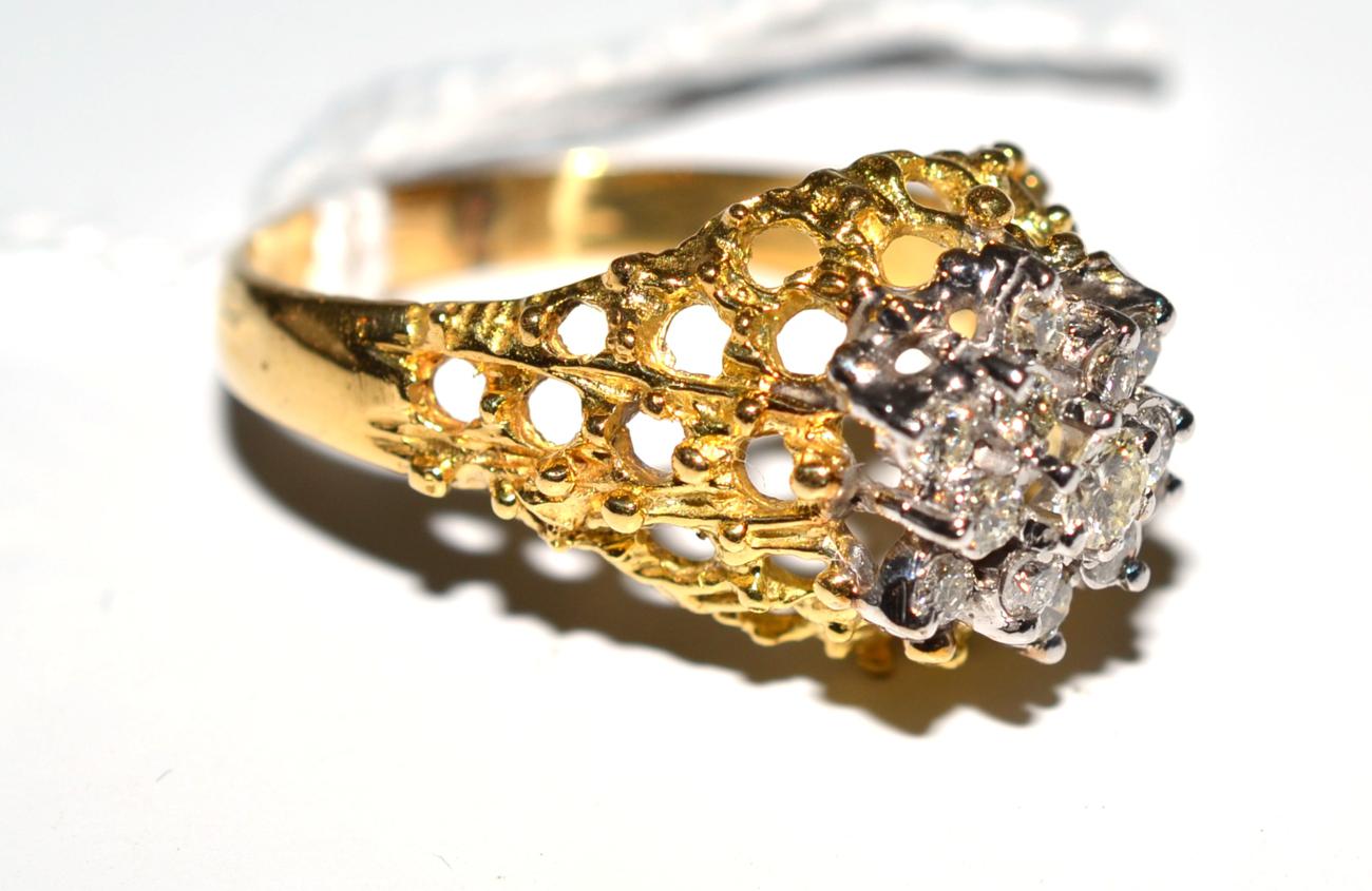 An 18ct gold diamond cluster ring, total estimated diamond weight 0.66 carat approximately