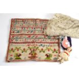 1884 unframed sampler, length of lace, miniature bisque doll and a celluloid doll