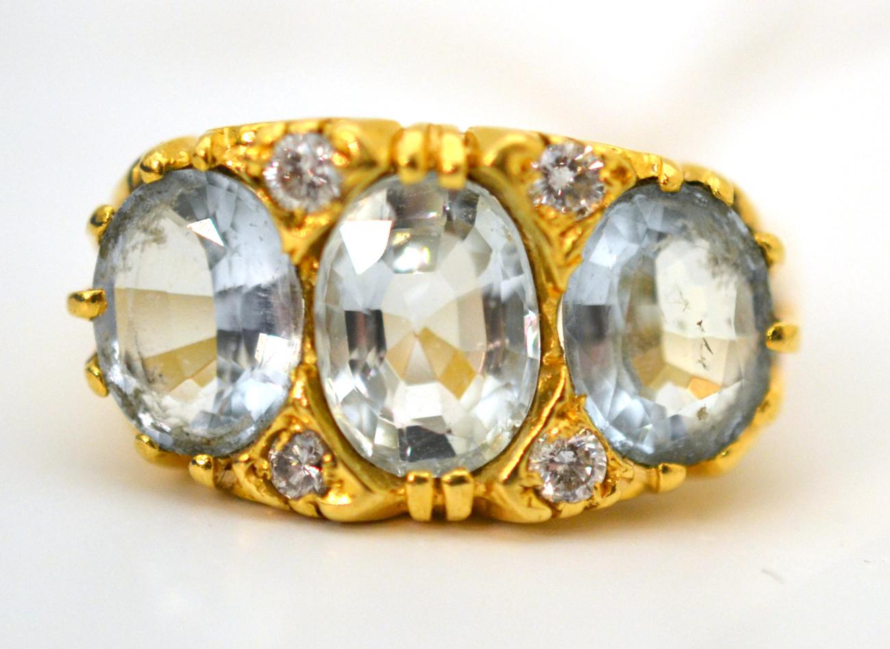 An 18ct gold aquamarine and diamond ring