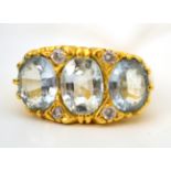 An 18ct gold aquamarine and diamond ring
