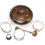 Silver mounted glass powder bowl with tortoiseshell cover, three silver napkin rings, a salt spoon