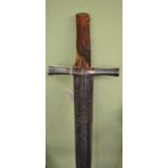 An 18th century broadsword, the 91cm double edge steel blade with three narrow fullers running