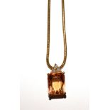 A topaz pendant on chain, both stamped '750'