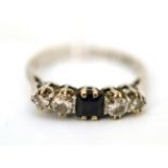 A sapphire and diamond five stone ring, stamped '18ct PLAT'