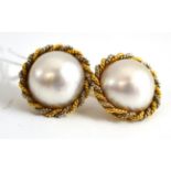 A pair of mabe pearl earrings