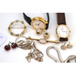 Two 9ct gold brooches, an emerald and diamond ring, assorted earrings, watches, silver jewellery