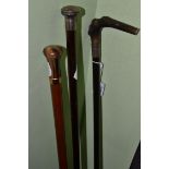 Walking cane with silver pommel, another example with horn handle and a walking stick with silver