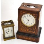 A brass carriage clock engraved ''DCY 1914'' and an inlaid rosewood clock (a.f.)