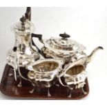 A silver four piece tea service, Walker & Hall, Sheffield 1917 (milk jug), 1918 (sugar bowl),