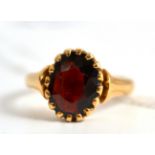 A garnet set ring, stamped '15ct'