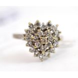 An 18ct white gold diamond cluster ring, the heart shape set with round brilliant cut diamonds,