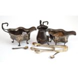 Two silver sauce boats, silver cream jug, two pairs of silver sugar tongs and two silver salt