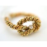 A 9ct gold diamond set rope twist ring