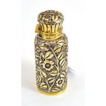 A Victorian silver gilt scent bottle, chased with flowers and leaves with glass liner and stopper,