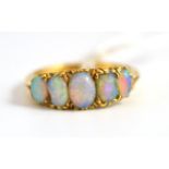 An opal five stone ring