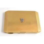 A 9ct gold compact, Asprey & Company Ltd, London 1939, rectangular with canted corner and all over