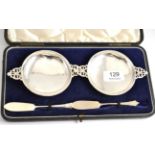 A pair of Victorian and later hallmarked silver circular butter dishes and a pair of silver butter