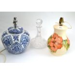 A Moorcroft Coral Hibiscus lamp, Edinburgh crystal decanter and a blue and white lamp (3)