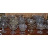 Twenty-eight Victorian pressed glass footed sugar bowls