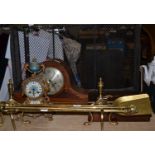 A brass spark guard, a brass companion set and fire dogs, a mahogany mantel clock, a gilt clock