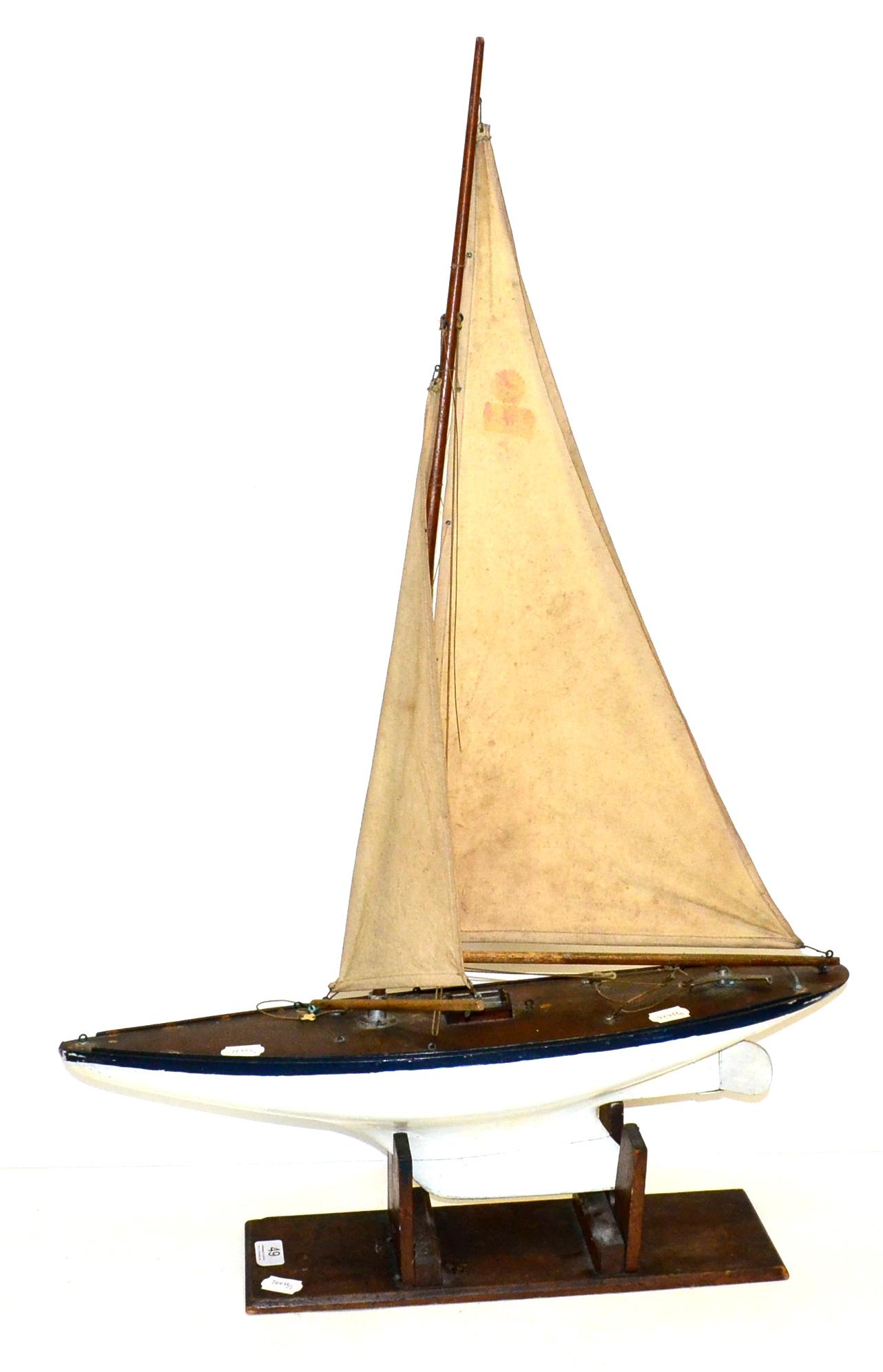 John Alexander (Preston) Pond Yacht with wooden hull and nicely patinated deck, twin sails on single