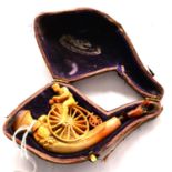 A Meerschaum Pipe or Cheroot Holder in the Form of a Man on a Penny Farthing Bicycle, in original