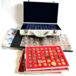 A Collection of 720+ Foreign Coins, housed in an aluminium case, albums & plastic cabinet trays, a