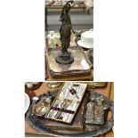 A bronzed figure of a maiden, two plated tea trays, pair of silver dwarf candlesticks, flatware etc