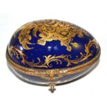 A Sevres style gilt decorated egg casket 14cm long by 10.5cm high. Rubbing to the gilt decoration,